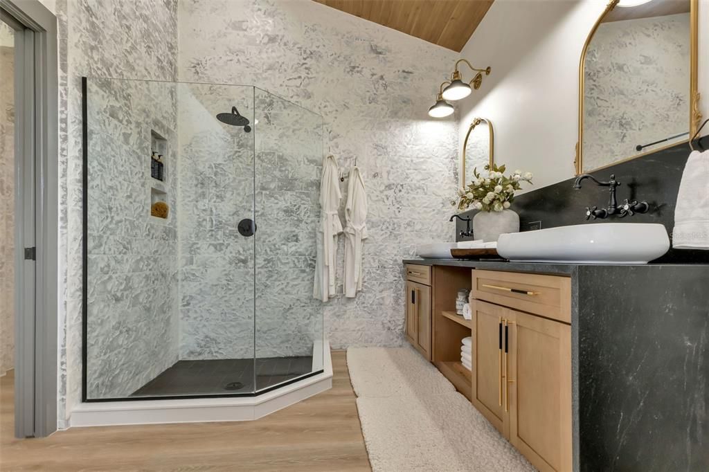primary bath featuring custom fixtures and spa details
