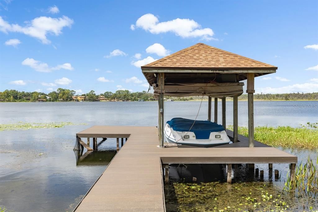 Private dock with automated boat lift, a haven for nautical enthusiasts and serene lakeside enjoyment.