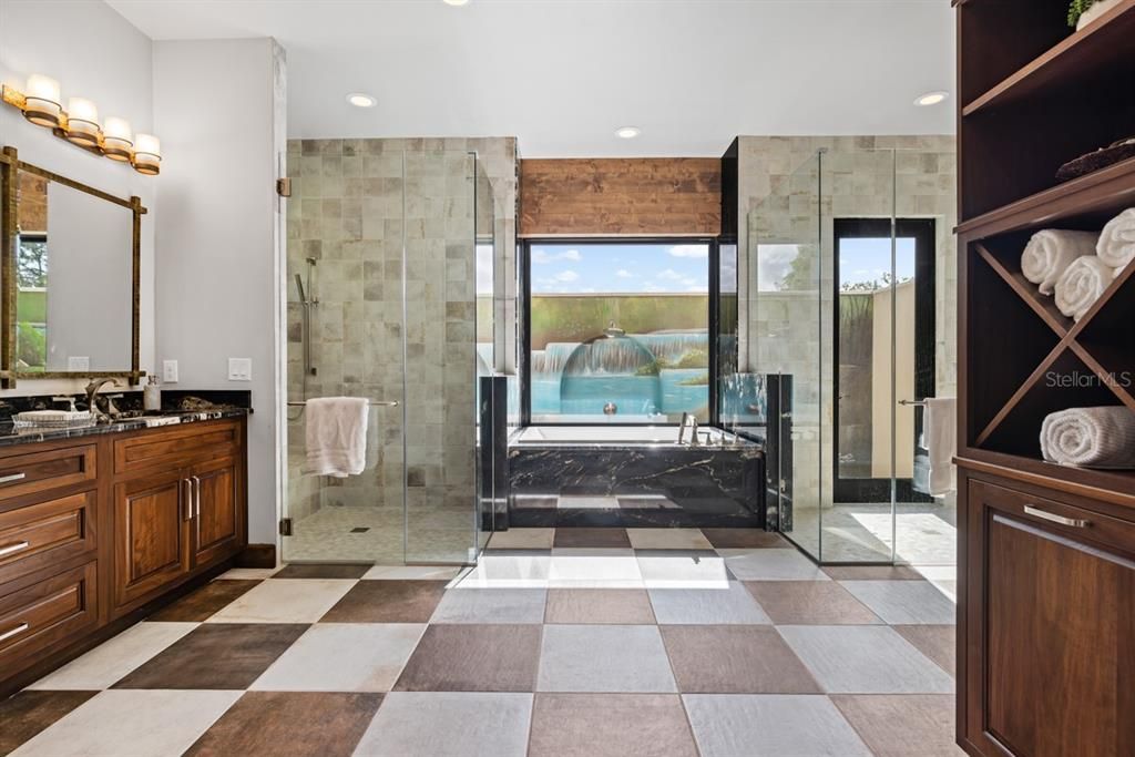 Another wonderful highlight of this stunning home is the sumptuous en-suite master bath, featuring dual vanities and double showers. This includes an exquisite outdoor shower, offering a complete spa-like pampering experience.