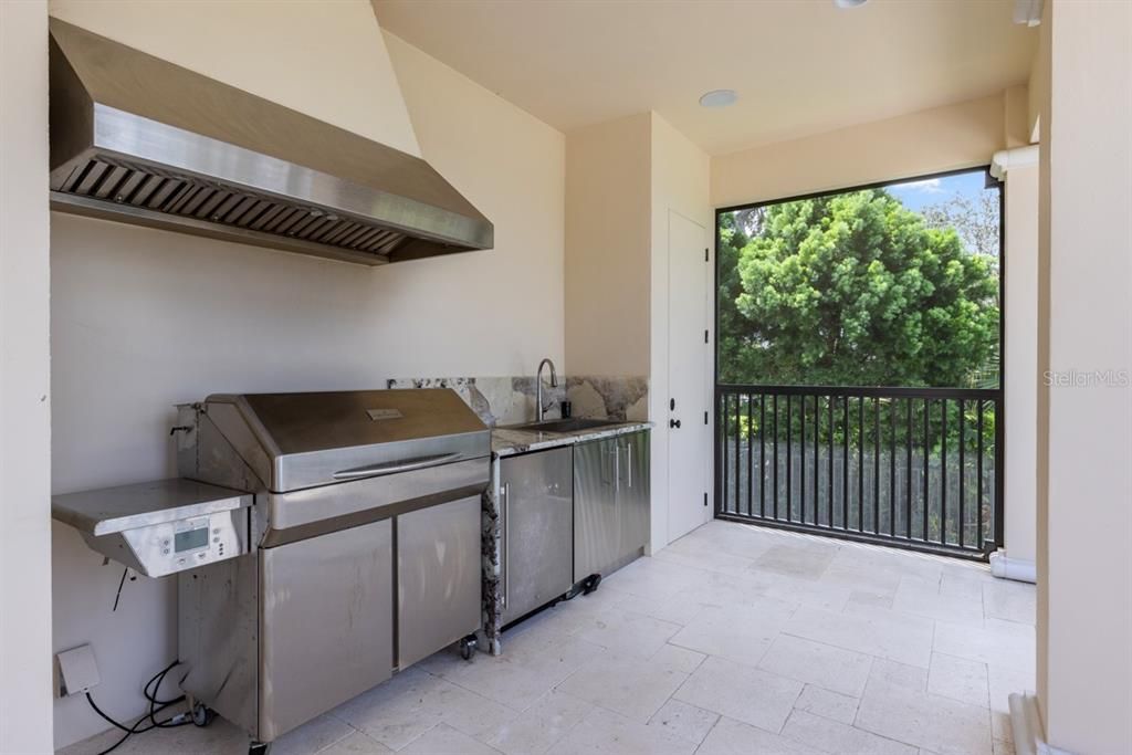 Fully-appointed outdoor kitchen, designed for delightful gatherings in the fresh, open air.