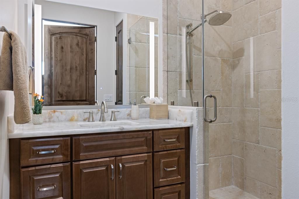 Upstairs en-suite third bathroom featuring a separate shower and bathtub.