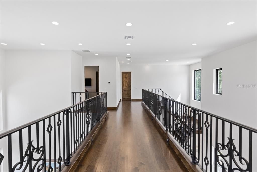 Majestic second-floor hallway with built in night lights.