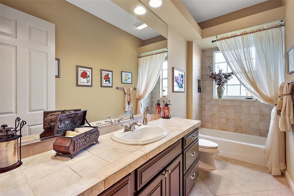 Guest bathroom w/tiled tub & shower combination