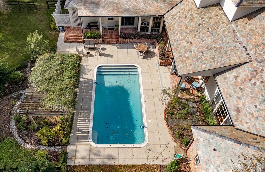 Sparkling in-ground pool and large backyard.