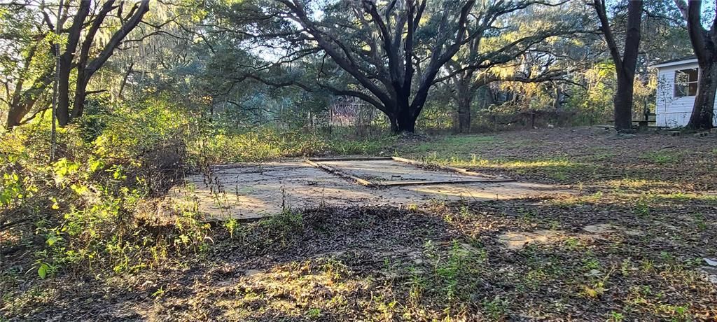 Large concrete pad in backyard