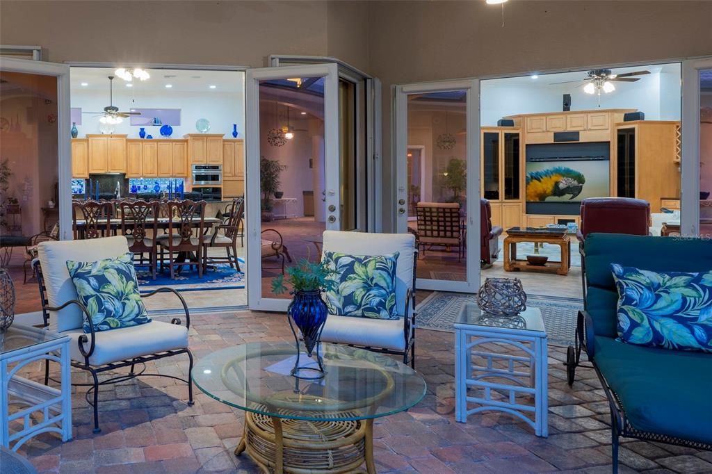 The lanai features many sitting areas, fireplace, summer kitchen, full bath and more!