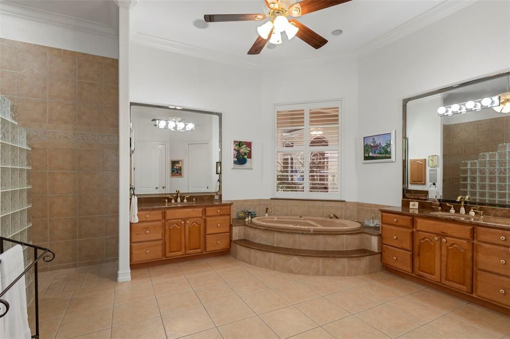 The master ensuite is well adorned with dual sinks, jacuzzi tub, walk in shower, water closet with bidet.