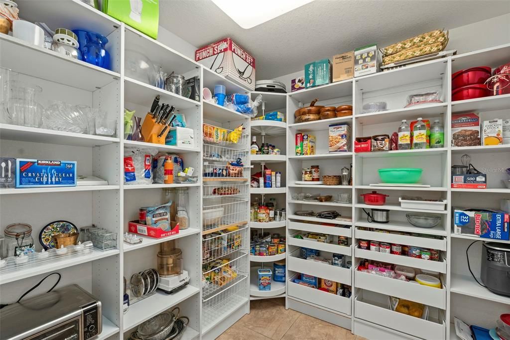 The walk in pantry is to die for! Featuring lots of storage!
