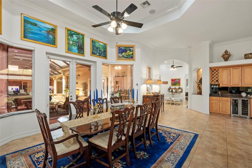 The large dining room is open is near the kitchen and opens up to the spacious courtyard lanai