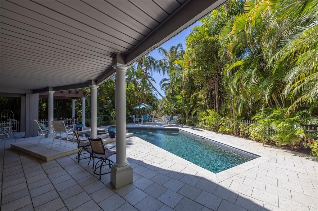 Enjoy the pool and spa surrounded by lush landscaping allowing for incredible privacy