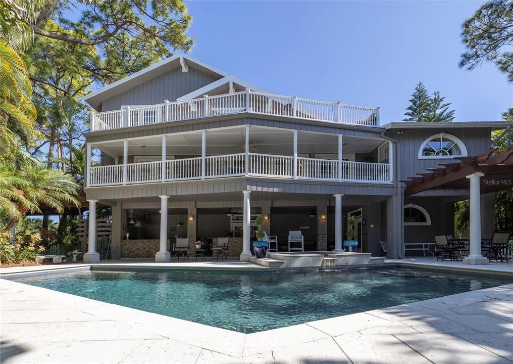 View of the back exterior of home and pool