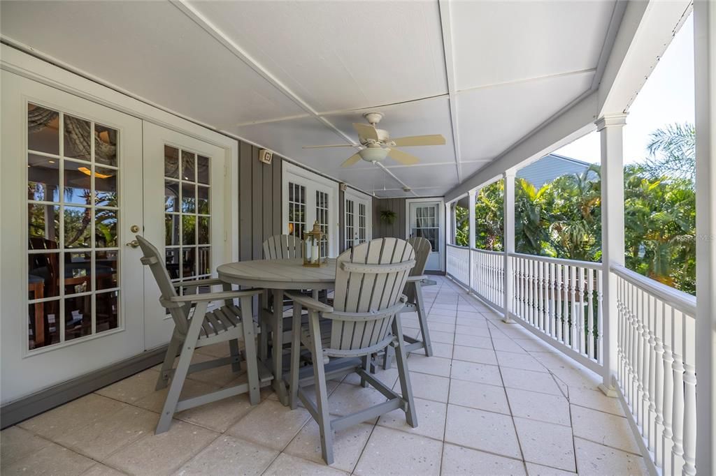 Main Floor balcony with French doors with access to the Kitchen, living room and Primary Bedroom