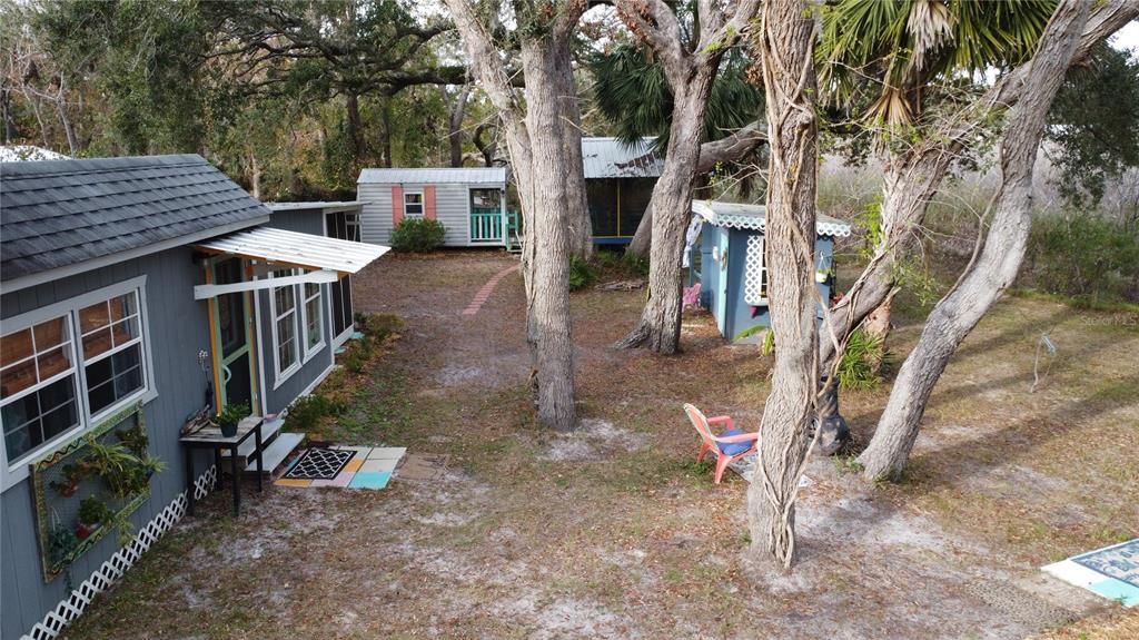 Main Cottage, another cottage with screened in porch and outdoor bath