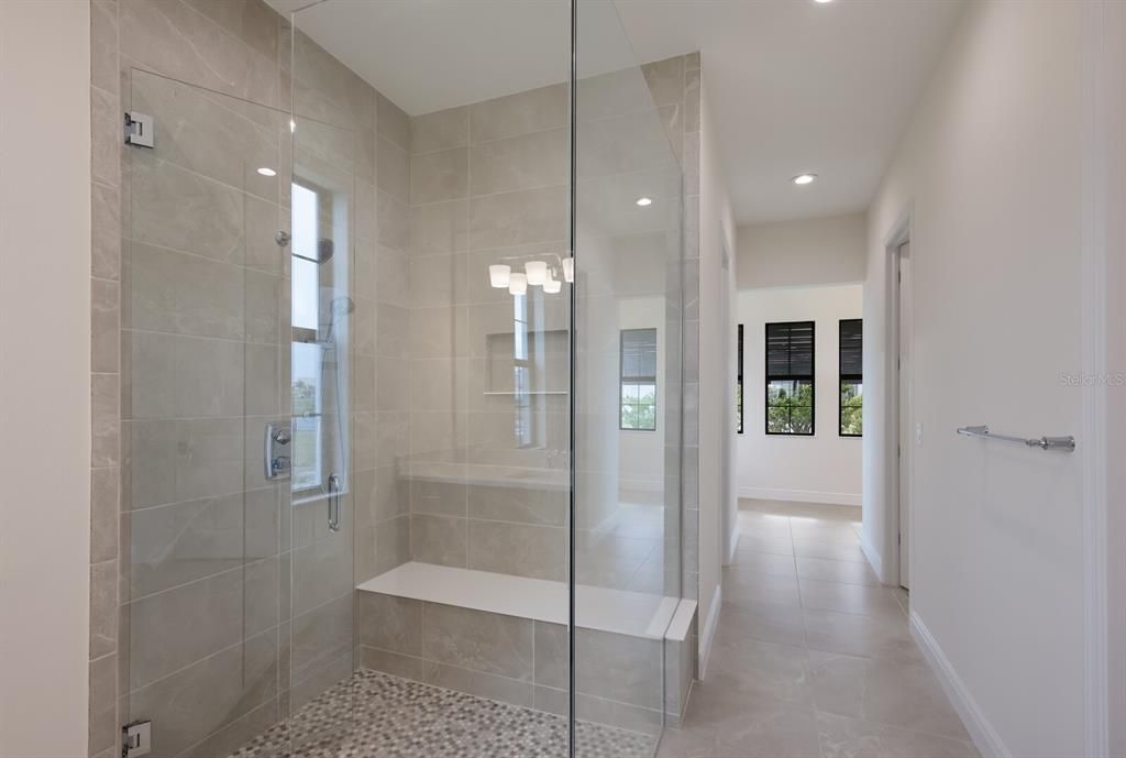 Modern shower in primary bathroom