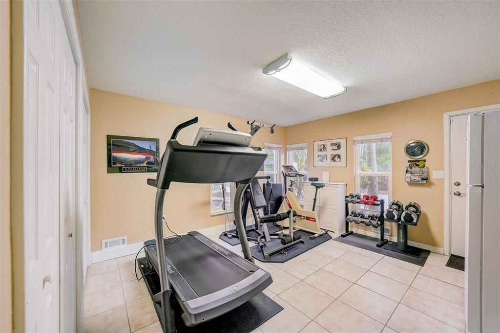 First floor gym or additional guest room 5 with private entrance