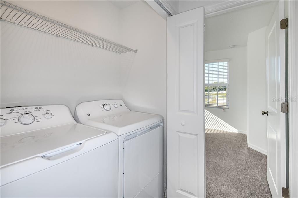 * REPRESENTATIVE PHOTO.  This utility room is ready to tackle all your laundry needs!