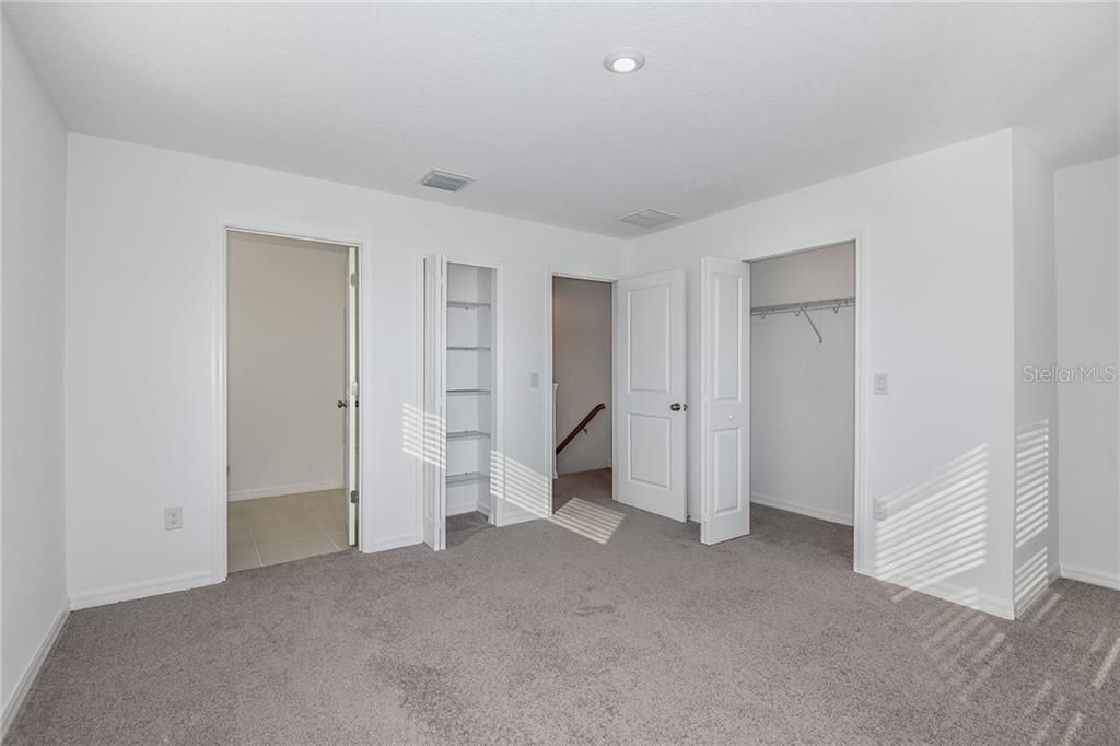 * REPRESENTATIVE PHOTO. The spacious primary suite has unlimited furniture placement options!