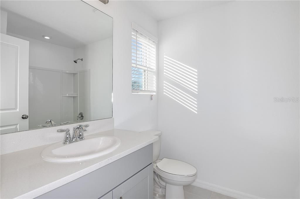 * REPRESENTATIVE PHOTO. The wall sized mirror compliments the spacious countertops and makes getting ready in the morning a breeze!