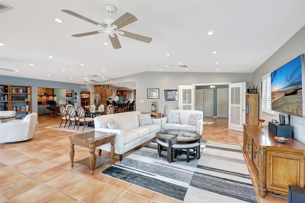 The living room, dining area, and kitchen are all connected without walls. It feels roomy and welcoming, making it easy for everyone to be together.