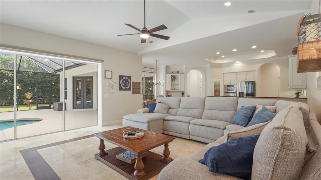Family room with pocket sliding glass door open to the pool.