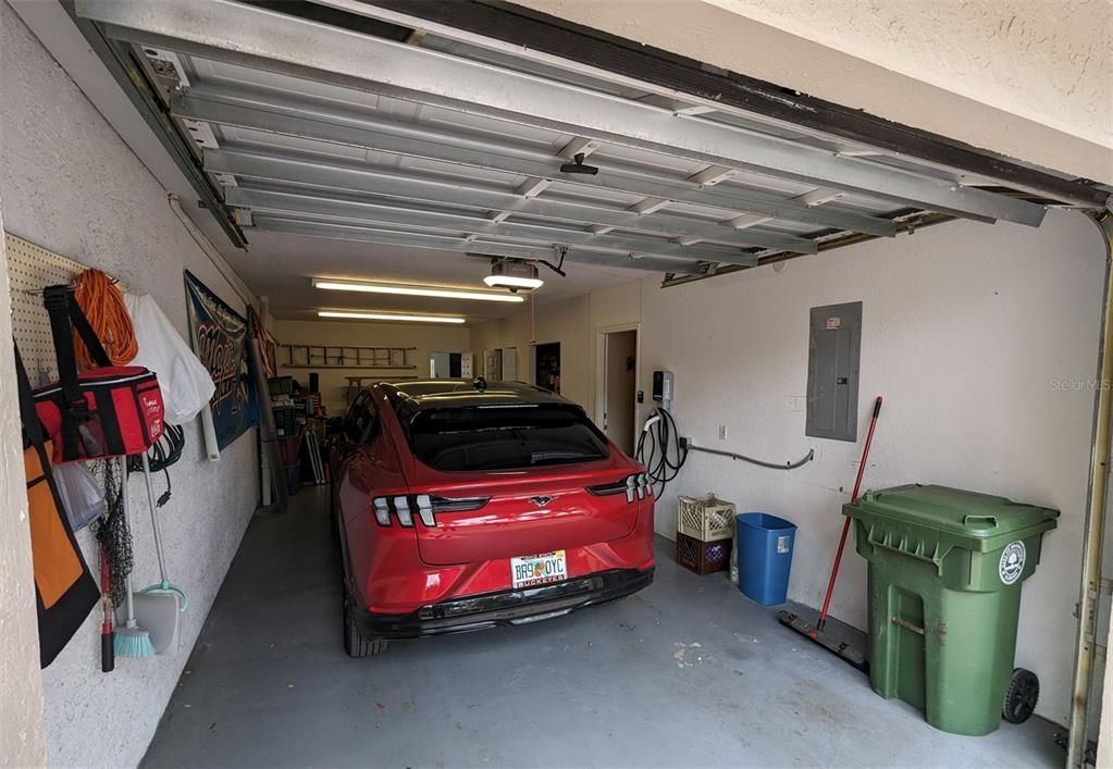2 Car Garage and additional workroom. Also, additional storage space under stairway. Wired for Electric Car.