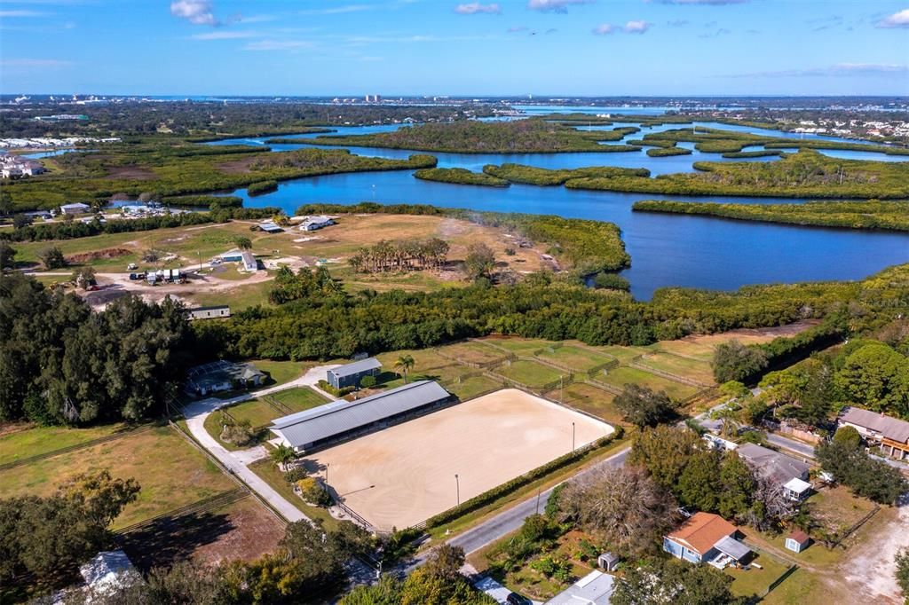 Waterfront horse farm w/income potential,  close to world famous beaches, City Life, 3 airports, major equestrian venues.