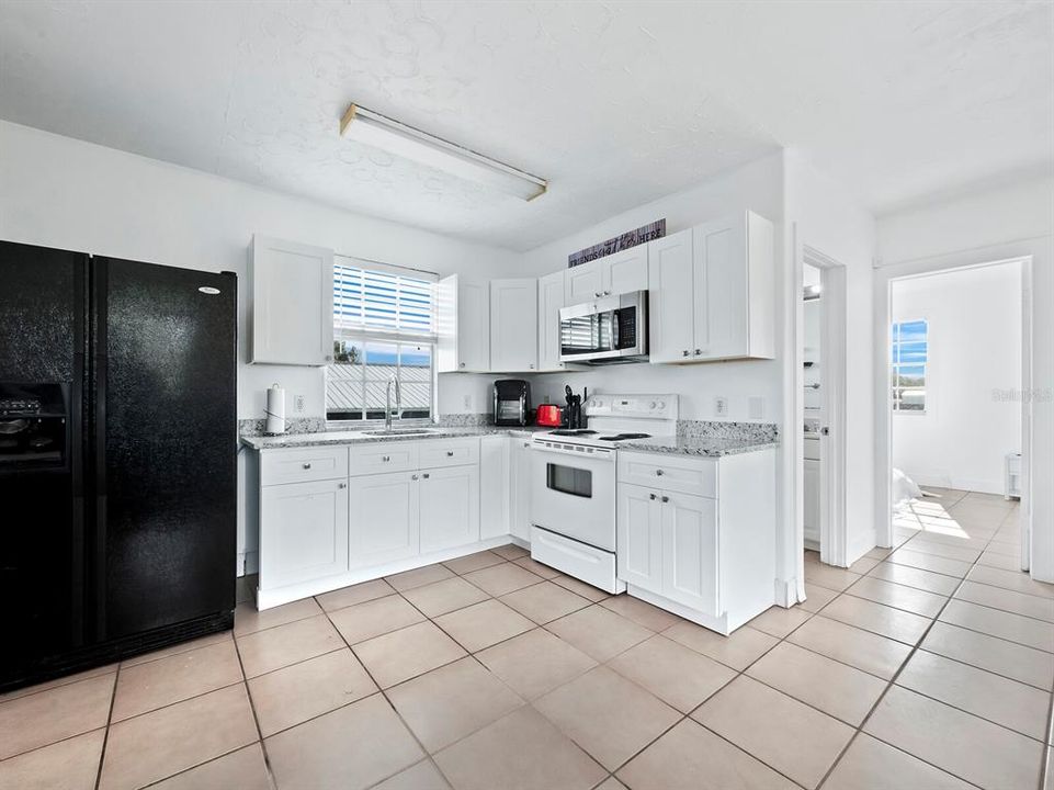 Kitchen with view to stables and arena