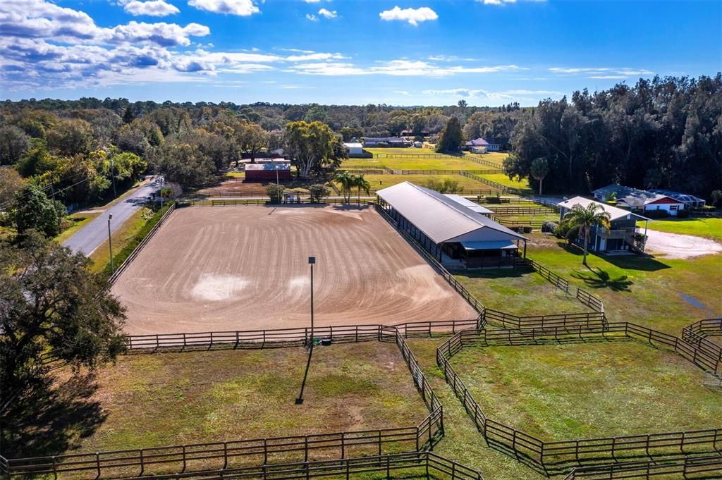 Lighted arena with good footing and irrigation system