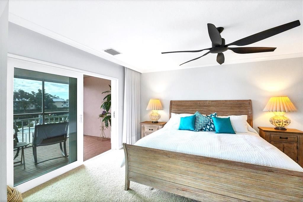 Master Suite extends to lanai & allows you to wake up to views of the pool & marina