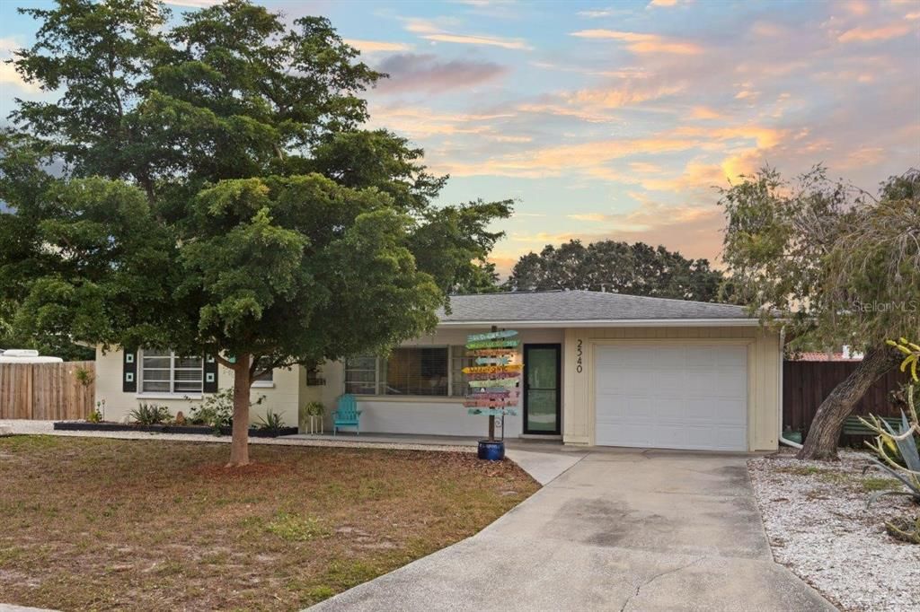 Front elevation showing the one car garage, and covered front porch.