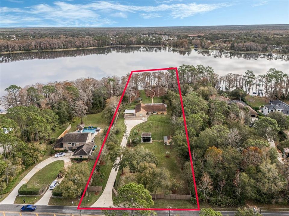 Located on almost 2 acres on Lake Price