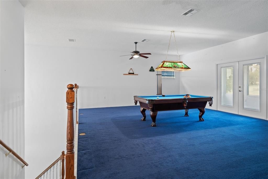 Great room on the upper level provides a separate space for leisure and recreation