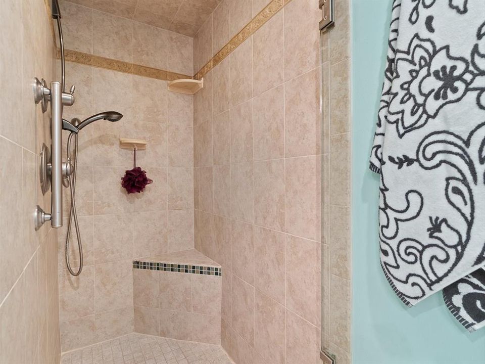 Primary Bathroom Shower Ceramic Tile and Shelving
