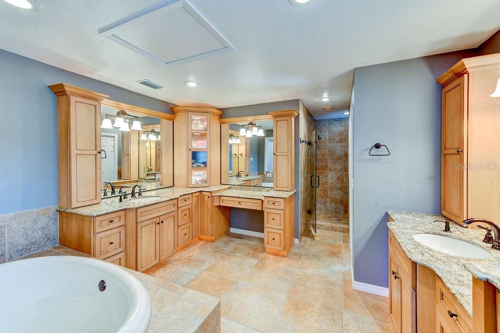 Master suite bath, his and her vanity with soaking tub