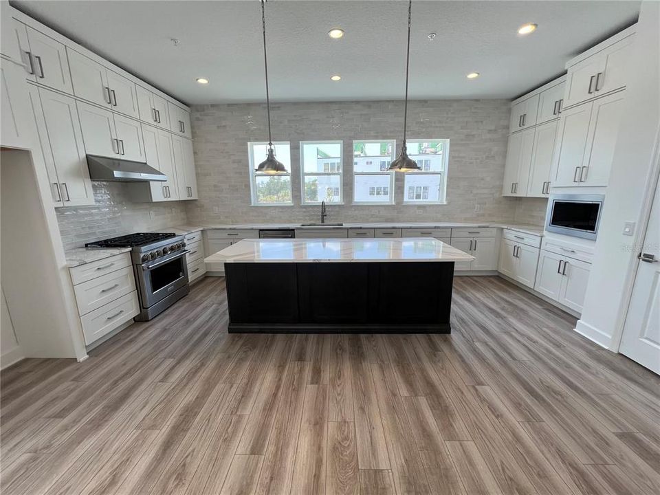 Large kitchen with plenty of cabinets and countertop space