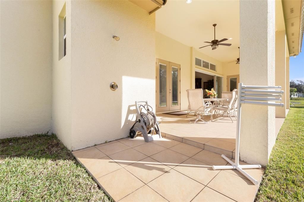 Large covered and tiled lanai with Outdoor Shower.