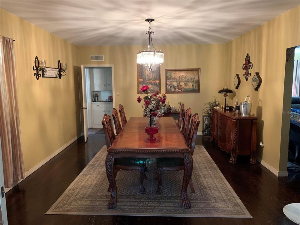 Dining Room. Table has 3 chairs on each side and room for the two captain chairs too!