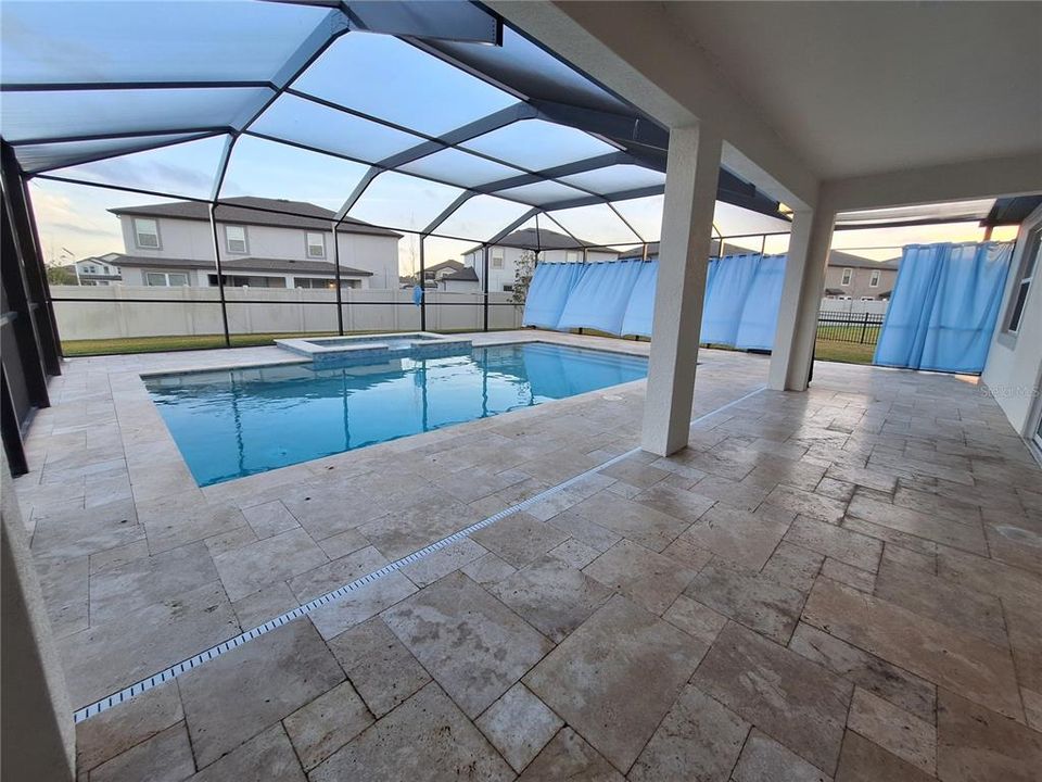 Beautiful lani view of pool & Patio with built in hot tub too!