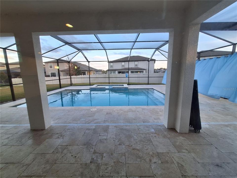 Incredible screened in pool experience to enjoy! Great place to BBQ & entertain