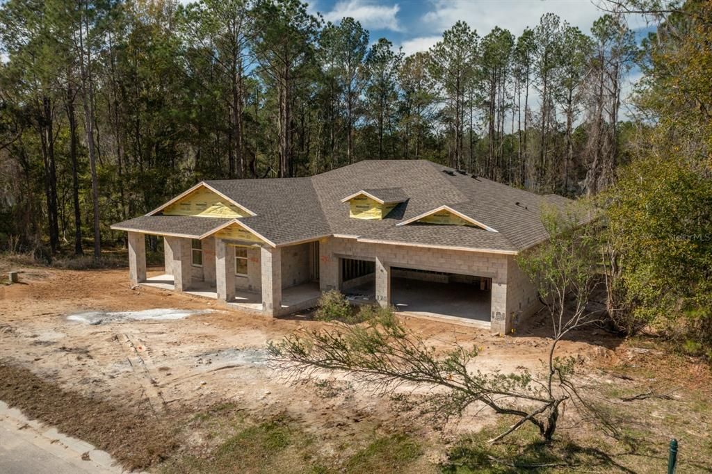 Trees wrap the home for some privacy