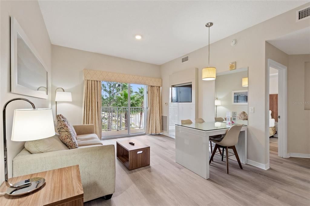 Living room with balcony in suite