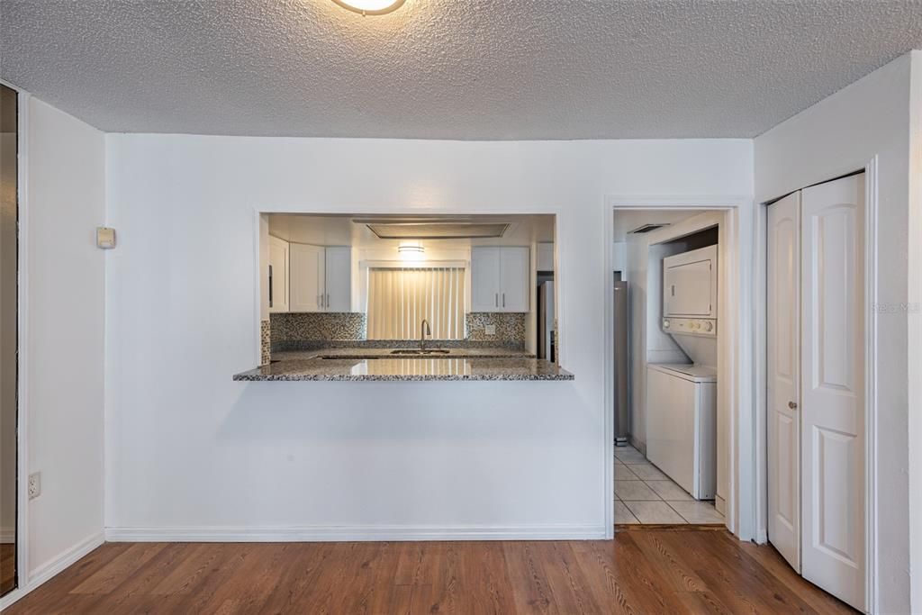 Convenient pass thru kitchen with breakfast bar.