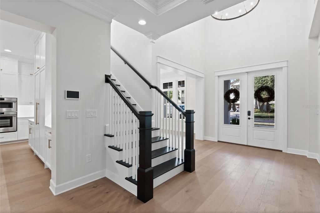 Two-story entrance foyer similar completed home