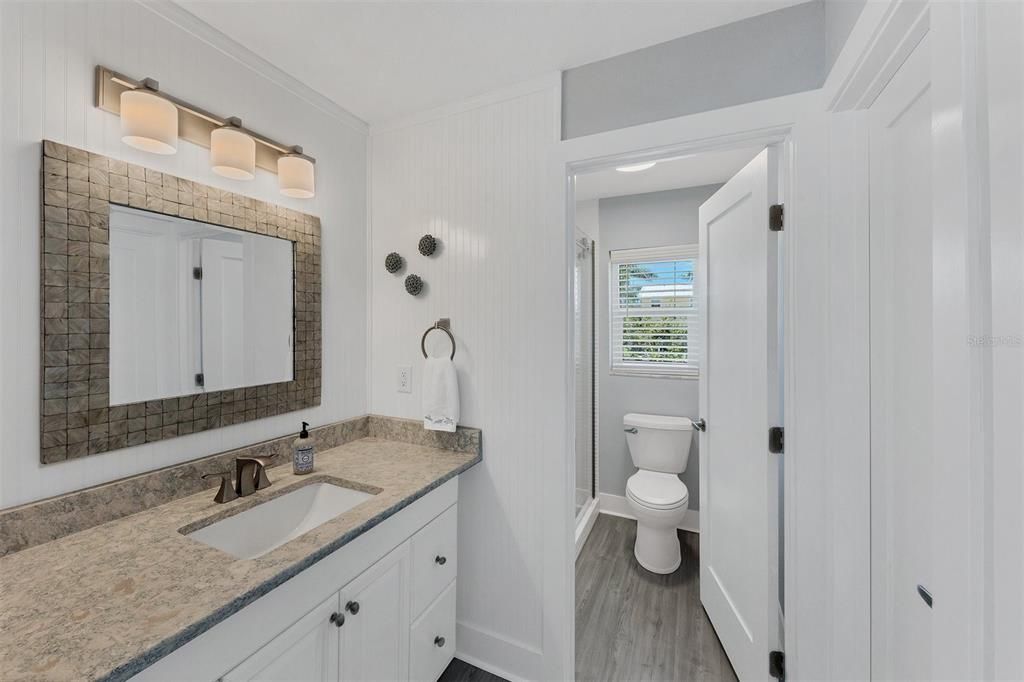 Master Bath features Cambria Stone countertop, Luxury Vinyl Flooring, Linen closet and access to large walk-in closet.