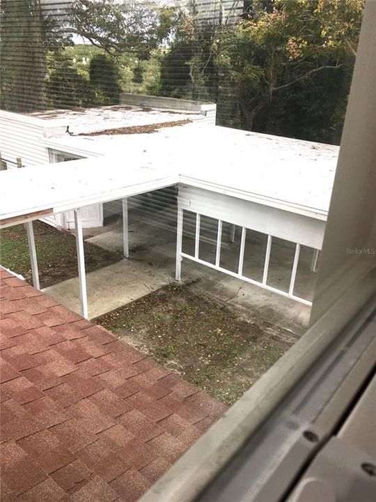 2nd story view of covered walkway & carport