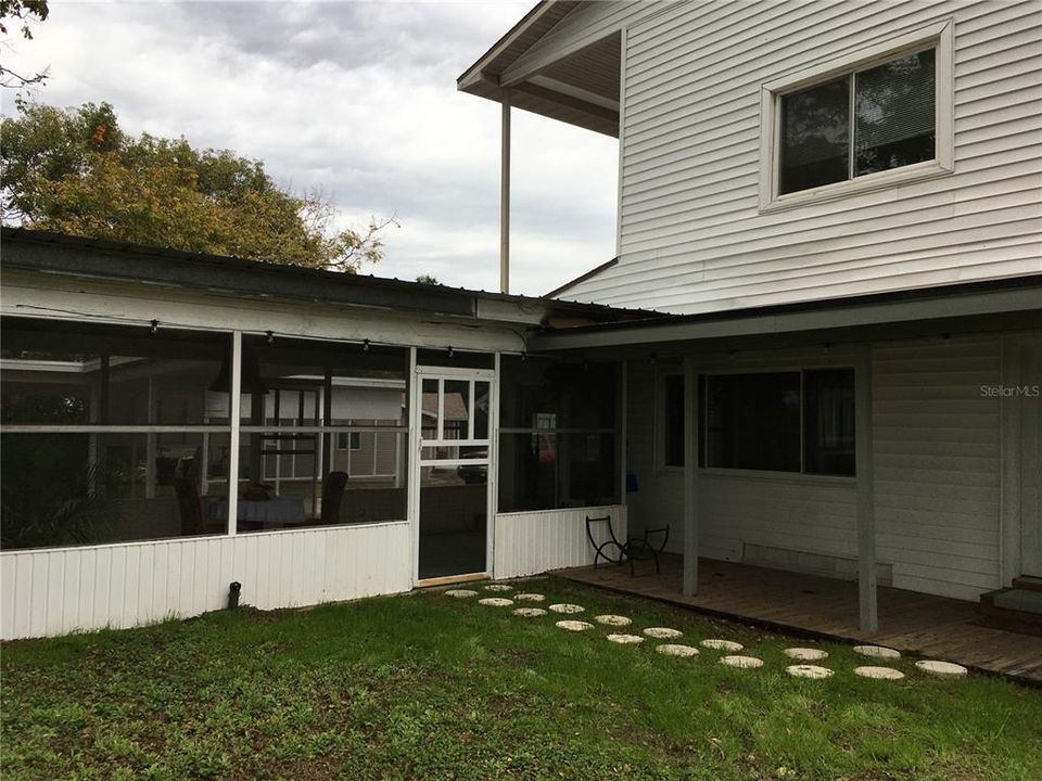 Screened porch & open porch areas at back of home