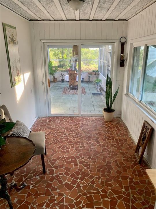 Florida room view of screened porch & backyard