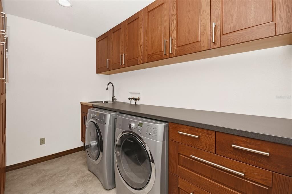 Laundry room with built in shelves
