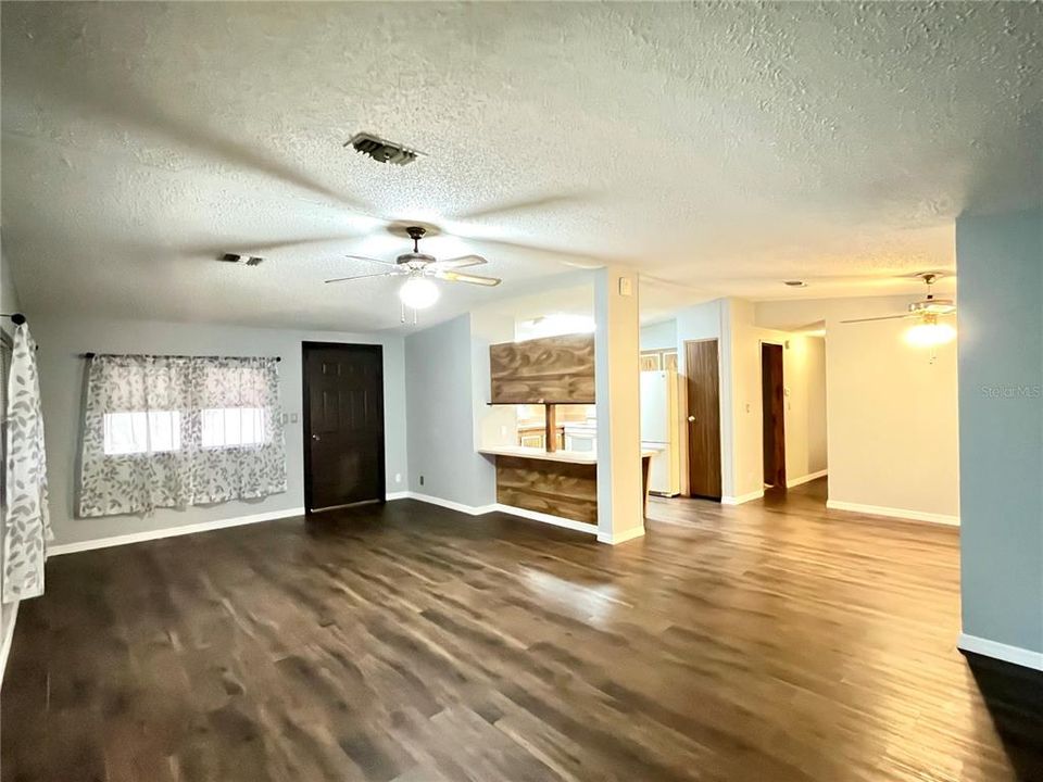 Large Living Room leading to Dining and Kitchen