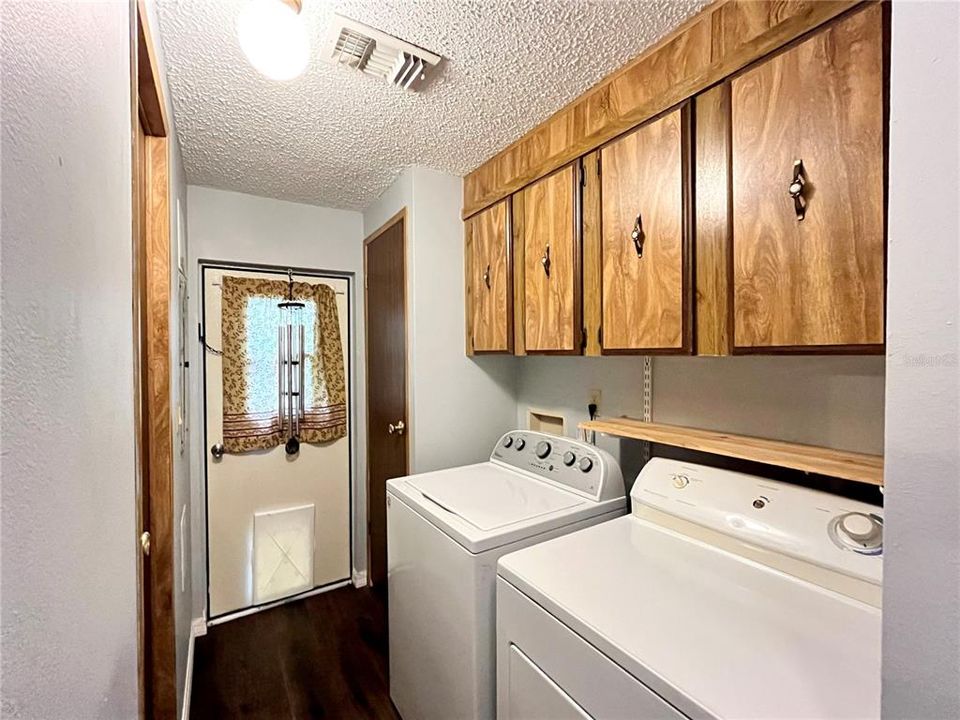 Laundry Room with Washer and Dryer and exterior, sideyard door
